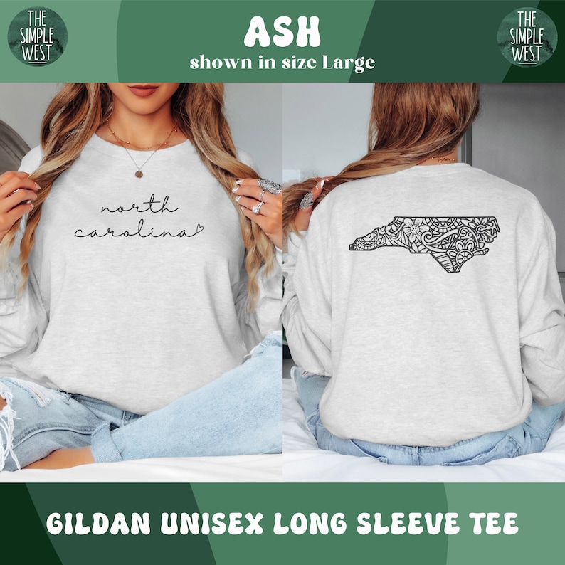 May include: Ash-colored Gildan unisex long sleeve tee. The front features the words "north carolina" in a script font. The back displays a black, detailed outline of North Carolina. The Simple West logo is in the top corners.