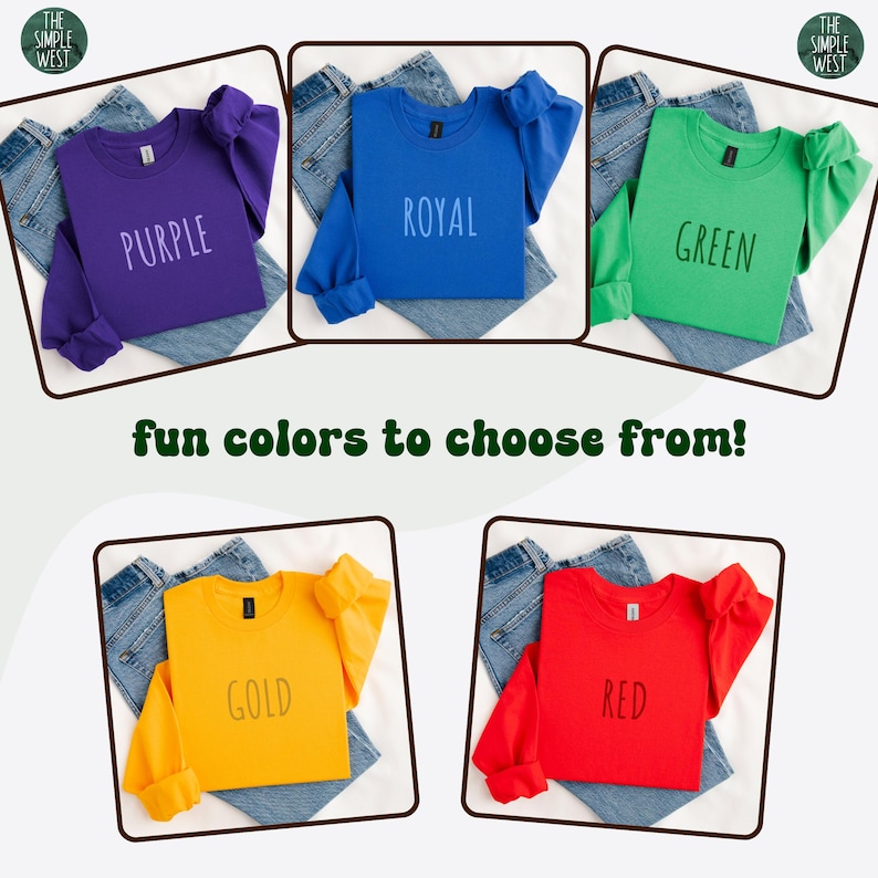May include: Five long-sleeved sweatshirts in purple, royal blue, green, gold, and red, each with a matching color word printed on the front. The sweatshirts are displayed on top of folded denim jeans. The text "fun colors to choose from!" is also present.