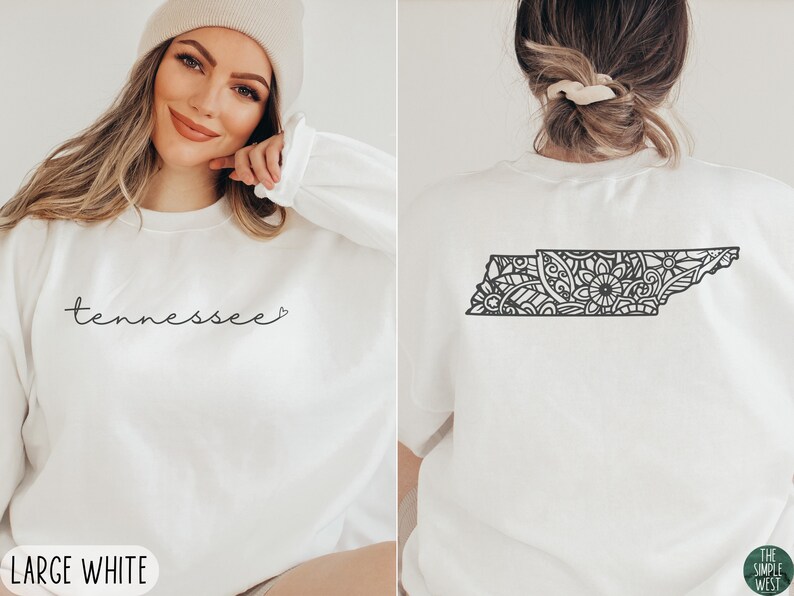 May include: White sweatshirt with the word "Tennessee" and a heart on the front. The back of the sweatshirt features a black and white mandala design of the state of Tennessee.