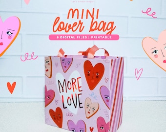 May include: A pink and red gift bag with a white handle and a pattern of hearts with faces. The bag says "More Love" in white letters. The bag is printed with the text "Mini Lover Bag" and "6 Digital Files | Printable".