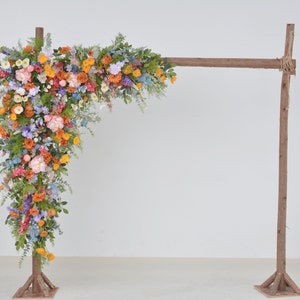 Wildflower Wedding Arbor Arrangements in Shades of Orange, Pink, Yellow, and Purple
