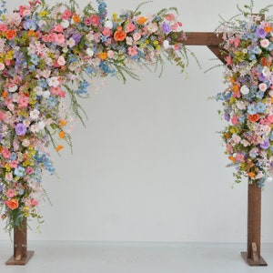 Pastel Wildflower Wedding Arbor Arrangements with Light Pink, Orange, Purple, and Blue Accents