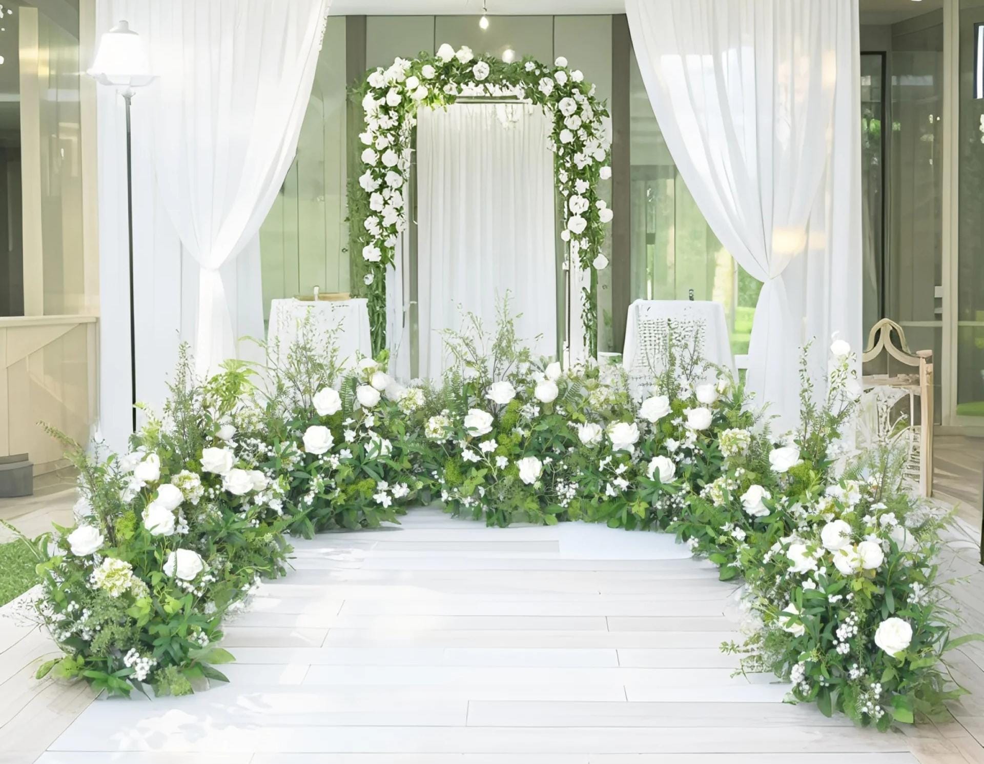 Grounded Arch Arrangements with Greenery and White Flowers