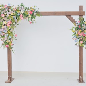 Wildflower Themed Wedding Arch Arrangements in Pink, Mauve, Blue and Yellow