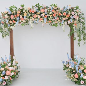 Pastel Peach, Blue, and White Floral Wedding Arbor with Coordinating Floor Pieces