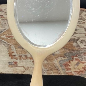 Vintage 40s Bakelite hand held mirror beveled edge
