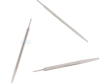 May include: Three silver-colored, pointed tools with a thin, textured tip. The tools are arranged at different angles against a white background. The tools appear to be jewelry making tools.