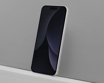 Peut inclure: Un smartphone argenté avec un écran noir, appuyé contre un mur gris. L'écran affiche un design sombre et abstrait. Le design élégant du téléphone est mis en valeur par son cadre métallique et son esthétique minimaliste.