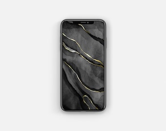 May include: A black smartphone with a gold and black abstract design on the screen.