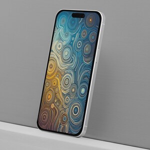 May include: A silver smartphone displays a colorful abstract design. The screen features a pattern of interconnected circles in shades of gold, blue, and brown. The phone is angled against a gray background.