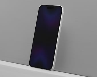 Peut inclure: Un smartphone argenté avec un écran noir, appuyé contre un mur gris. L'écran du téléphone affiche une image sombre et floue avec des touches de violet et de bleu. Le téléphone a un design élégant et moderne.
