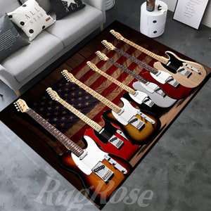 May include: A rug with a woodgrain background and an American flag design. Six electric guitars are arranged on the rug, with the necks pointing towards the top of the image. The guitars are in various colors, including red, brown, black, and white.