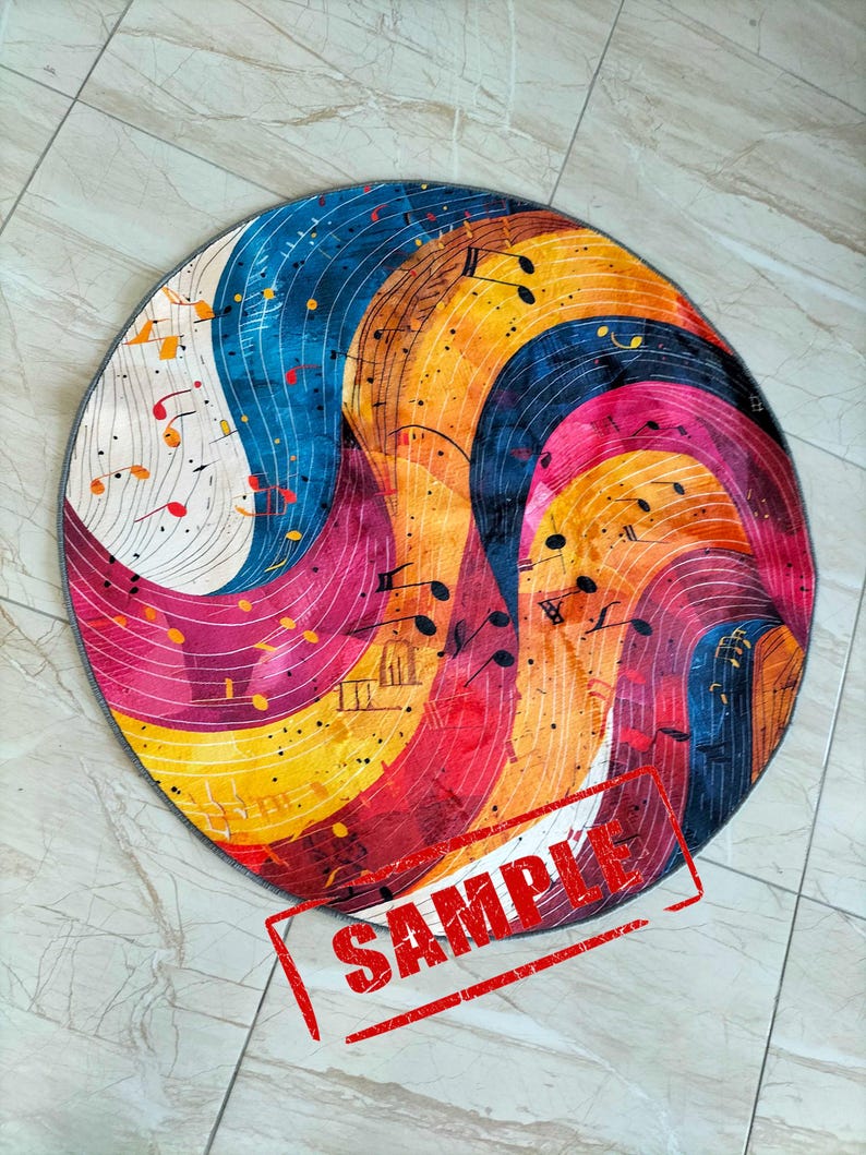 May include: A round rug with a colorful abstract design featuring musical notes and swirls of blue, yellow, red, and white. The rug has a gray border.