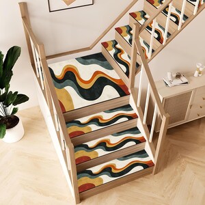 May include: Wooden staircase with steps and risers fitted with patterned rugs. The rugs display a retro design with yellow, orange, teal, and black wavy patterns. The staircase has a wooden handrail and balustrades.