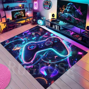 May include: A neon gamer rug featuring a black video game controller in the centre. The controller is surrounded by colourful neon lights and abstract shapes. The rug has a dark blue background with a subtle sparkle effect.