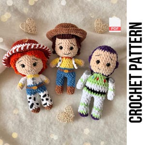 May include: Three crocheted Toy Story character dolls: Jessie, Woody, and Buzz Lightyear. The dolls are crafted from yarn and feature detailed designs. The image includes the text "CROCHET PATTERN" on the right side, indicating a pattern for making these toys.