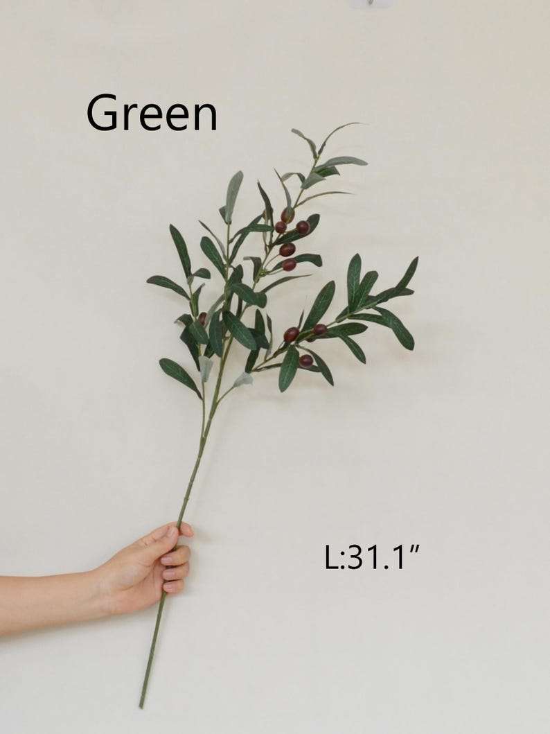 May include: Green artificial olive branch with small dark red berries. The branch is 31.1 inches long.