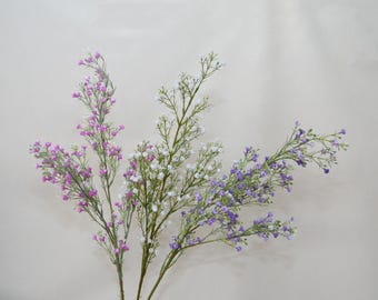May include: A collection of artificial floral stems with delicate, small blooms in shades of purple, white, and pink. The stems have thin, green branches, creating a natural and airy appearance. Perfect for adding a touch of color and texture to any floral arrangement.