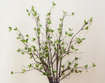 フェイクの若い葉の小枝の工芸品、柔らかい葉が付いた人工の枯れ木の