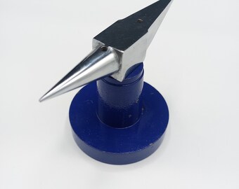 Yunque de doble cuerno con base azul redonda