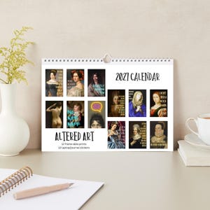 May include: A 2027 calendar titled Altered Art featuring twelve classical portrait prints with humorous text overlays. The calendar includes twelve laptop or journal stickers and displays various historical figures in paintings with modern captions.