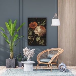 May include: A framed floral print with a dark background featuring a white and orange rose with green leaves.