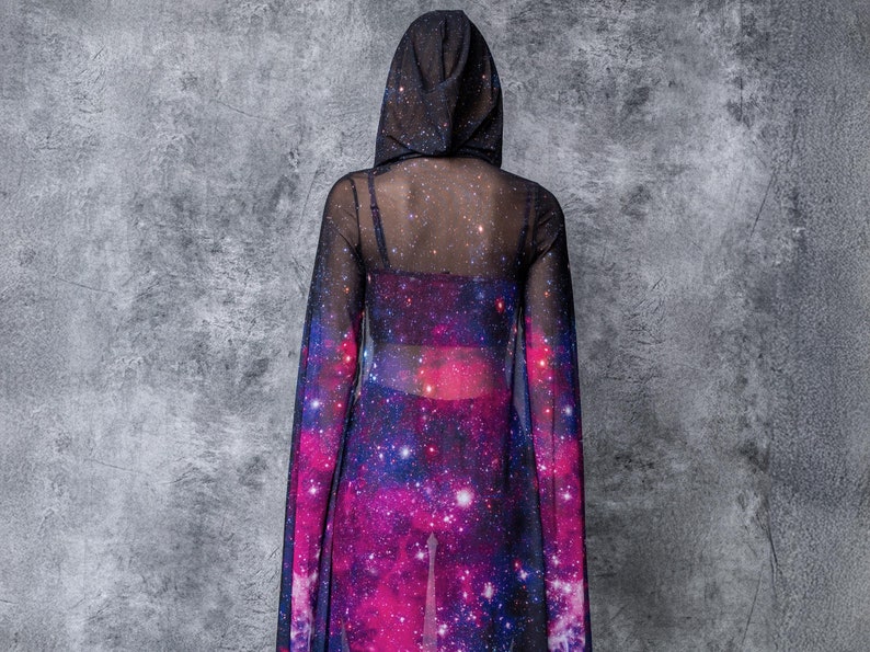 May include: A black mesh hooded top with a galaxy print. The top is sheer and has long sleeves.