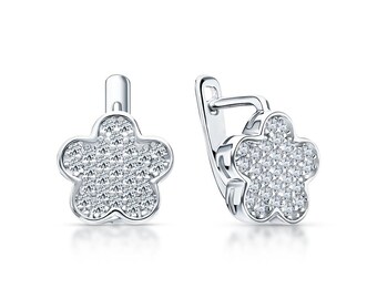 May include: A pair of silver-toned flower-shaped earrings. Each earring features a five-petal design, fully encrusted with small, sparkling clear stones. The earrings have a lever-back closure.