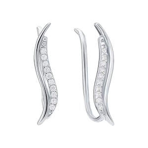 May include: A pair of silver earrings with a curved, wave-like design. Each earring is adorned with a row of small, clear cubic zirconia stones.