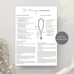 May include: A white informational sheet titled The Rosary Praying Guide with black text. It lists the Joyful, Sorrowful, Glorious, and Luminous Mysteries, instructions on how to pray the rosary with a diagram, and various prayers like the Apostles Creed.