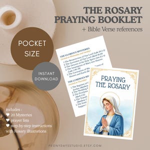 May include: A pocket-sized prayer booklet titled PRAYING THE ROSARY, featuring an illustration of a figure in a blue robe and white veil with hands clasped in prayer. The booklet includes text listing the Glorious and Luminous Mysteries.