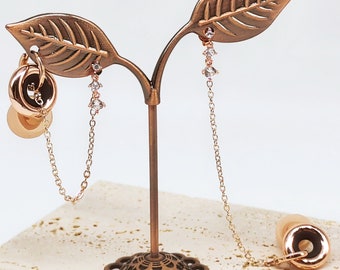 Brincos AirPods com zircônia em ouro rosé: joia com protetor auricular em formato de agulha em prata 925