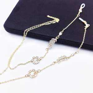 Zonnebrilketting met bedel zirkoon: lenzenvloeistofband voor dames