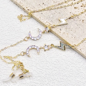 Gouden brillenketting: spektakelketting maan, ster en bliksem
