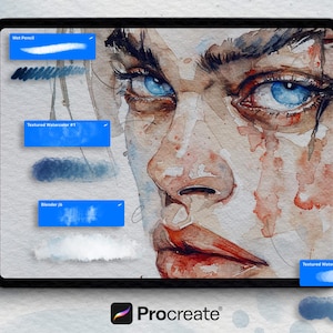 May include: Digital art on a tablet featuring a watercolor portrait with striking blue eyes and red lips. The screen displays various Procreate brushes, including "Wet Pencil" and "Textured Watercolor #1". A white stylus is placed on the right.