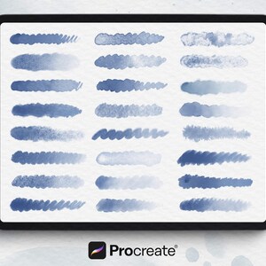 May include: A digital art display on a tablet shows various blue watercolor brushstrokes. The tablet is positioned next to a white stylus. The Procreate logo is visible at the bottom, indicating a digital art tool.