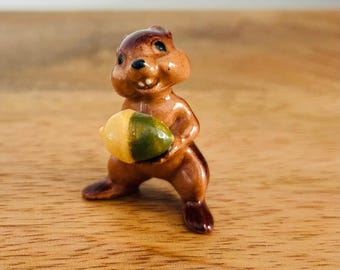 Vintage Hagen-Renaker ceramic chipmunk figurine holding an acorn