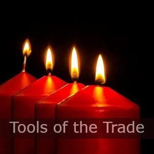 May include: Four red candles with flames burning, arranged in a row. The candles are on a black background. The text "Tools of the Trade" is at the bottom of the image.