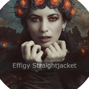 May include: A woman with dark hair and a crown of black roses with orange flames inside the roses. She is wearing a black dress and has her hands tied together with rope. The background is a dark, blurry image of a forest with fire.