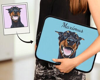 May include: A blue laptop sleeve with a black and brown dog illustration and the name "Maximus" printed on it.