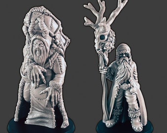 May include: Two detailed, gray, miniature figurines of winter-themed figures. The figure on the left is a cloaked figure with horns and a beard, holding a scroll. The figure on the right is a bearded figure with a staff topped with a deer skull and antlers.