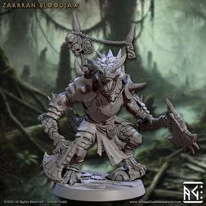 May include: A detailed, gray miniature figure of Zarrkan Bloodjaw, a reptilian humanoid warrior. The figure is in a battle stance, holding a spiked axe and shield. The figure has armor, horns, and a skull-adorned banner.