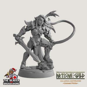 May include: A gray fantasy miniature of a warrior woman in armor, holding a sword and a whip. The figure is standing on a rocky base. The text "THE BEAVER BROADSWORD" and "ARTISAN GUILD" are visible.