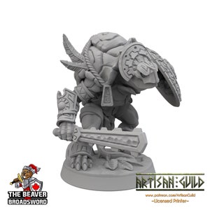 May include: A grey 3D printed miniature of a creature with shell-like armour, holding a sword and standing on a base. The creature has a feathered head and is wearing a shield on its back.
