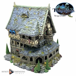May include: A detailed miniature fantasy house with a gray tiled roof, wooden beams, and stone accents. The house features multiple levels, balconies, and arched windows. The text "Torbridge" and "The Last Hearth" are visible.