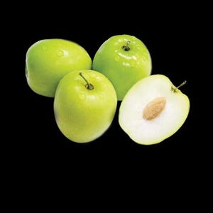 May include: Four green jujubes, one cut in half to reveal the white flesh and a brown seed.