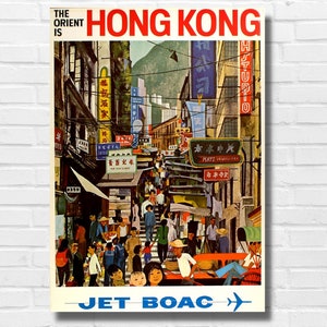 May include: A vintage travel poster advertising Hong Kong with a vibrant illustration of a crowded street scene with colorful shops and signs. The text "The Orient is" and "HONG KONG" are in red and white. The bottom of the poster reads "JET BOAC" in blue with a blue airplane icon.