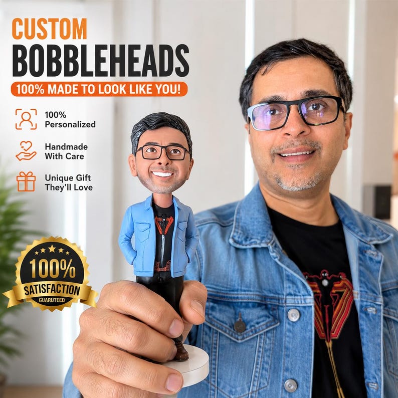 May include: A custom bobblehead figurine depicting a person with dark hair and glasses, wearing a light blue denim jacket over a black graphic t-shirt. The text on the image reads CUSTOM BOBBLEHEADS 100% MADE TO LOOK LIKE YOU! 100% Personalized, Handmade With Care, Unique Gift They'll Love, and 100% SATISFACTION GUARANTEED.