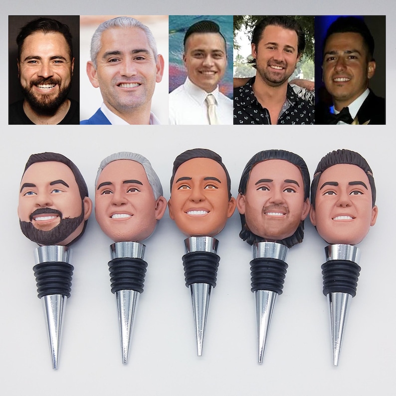 May include: Five bottle stoppers with faces, each with a different man's likeness. The stoppers have silver-colored conical bases and black rubber seals. Above the stoppers are the corresponding headshots of the men.