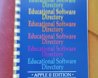 May include: A blue spiral bound book with the title "Educational Software Directory - APPLE II EDITION" printed on the cover.